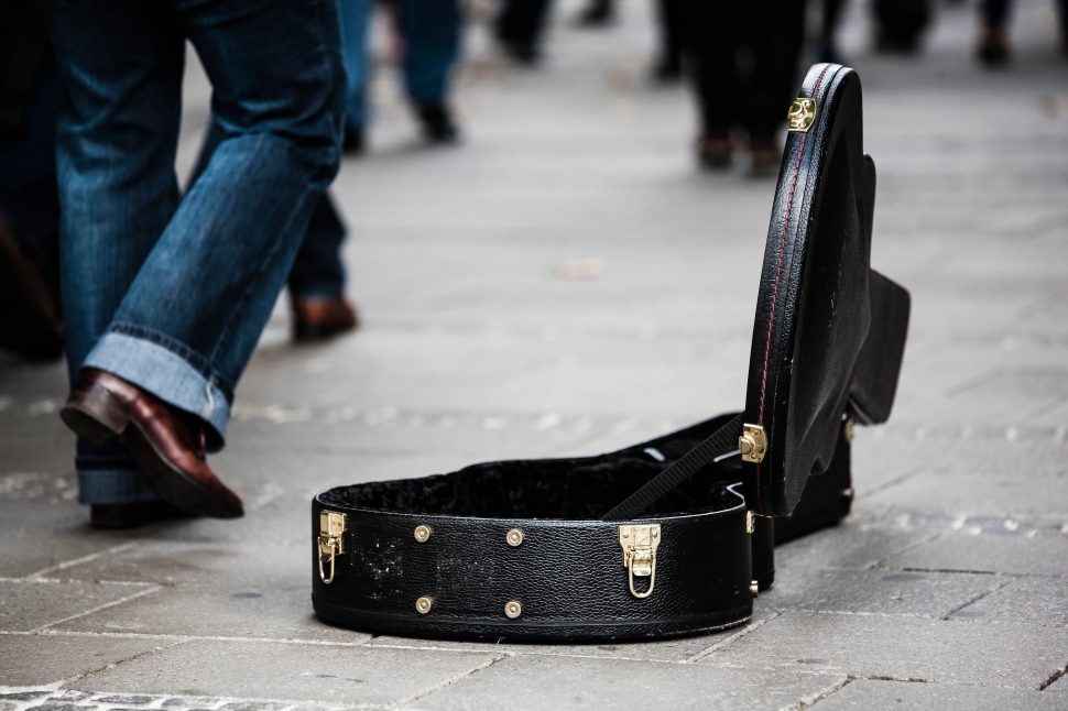 black leather guitar case on the streets preview
